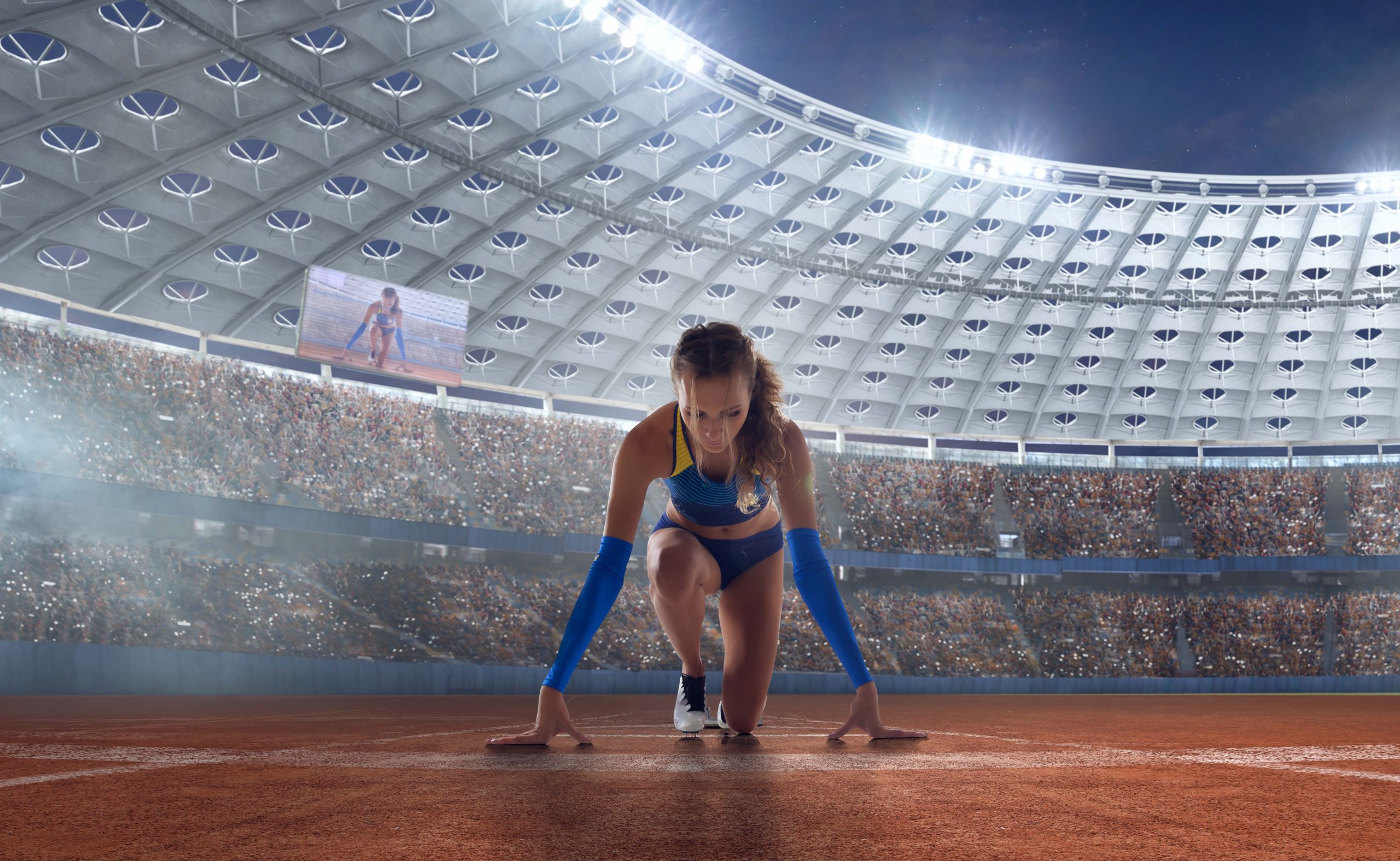 Athlète prête à courir dans un stade rempli pendant les Jeux Olympiques Paris 2024 - gestion des punaises de lit dans les hébergements, un défi majeur pour l'événement mondial.